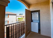 Thumbnail 53 of 61 - A white refrigerator is in a small kitchen area.