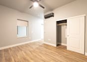 Thumbnail 61 of 81 - A room with a ceiling fan and a window.