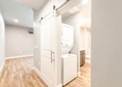 Thumbnail 63 of 81 - A white door is open to a bathroom.