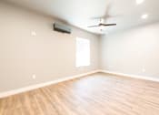 Thumbnail 65 of 81 - A room with a ceiling fan and a window.