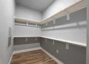 Thumbnail 74 of 81 - A long, empty hallway with a white wall and a grey wall.