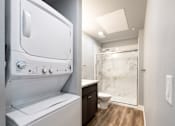Thumbnail 79 of 81 - A white oven and microwave in a modern kitchen.