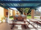 Thumbnail 15 of 24 - A picnic table is in the middle of a patio.