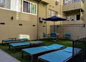 Thumbnail 10 of 11 - View of gated community pool lounge and seating area