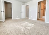 Thumbnail 8 of 54 - View from bedroom into bathroom, hall way and closet, carpet flooring