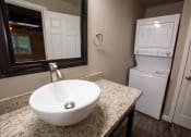 Thumbnail 9 of 18 - bathroom with vanity and stacked washer dryer