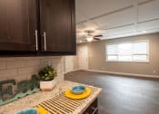 Thumbnail 1 of 18 - View from kitchen to living room with wood floors