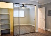 Thumbnail 9 of 16 - View of bedroom with sliding glass mirror door closet