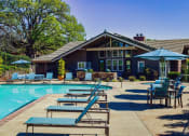 Thumbnail 35 of 54 - View of pool and club room, lounge chairs, and seating