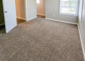 Thumbnail 6 of 54 - View of bedroom with carpet flooring and well lit windows
