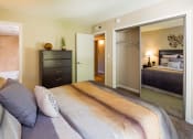 Thumbnail 29 of 36 - furnished bedroom with large mirrored door closet