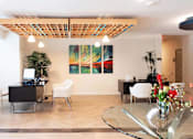 Thumbnail 5 of 65 - a living room with a table and chairs and a painting on the wall  at Parks Residential - Richardson, Richardson