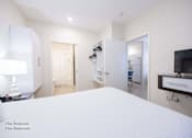 Thumbnail 22 of 65 - a bedroom with a large white bed and a tv  at Parks Residential - Richardson, Richardson, 75082