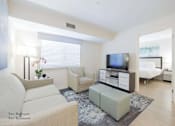 Thumbnail 27 of 65 - a living room with a couch and a tv at Parks Residential - Richardson, Richardson