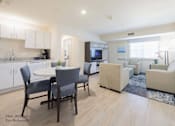Thumbnail 46 of 65 - a dining room and kitchen area with a table and chairs at Parks Residential - Richardson, Texas