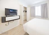 Thumbnail 58 of 65 - Bedroom With TV at Parks Residential - Richardson, Richardson, 75082