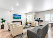 Thumbnail 2 of 12 - a living room with couches and chairs and a television at Parks Residential - Denver, Centennial Colorado