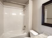 Thumbnail 7 of 16 - View of bathroom with tub shower combo
