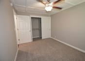 Thumbnail 12 of 27 - View of bedroom with carpet flooring, ceiling fan, sliding door access to closet