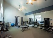 Thumbnail 13 of 26 - Selby Ranch fitness center located at the clubroom with free weights and weight machines