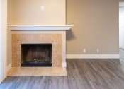 Thumbnail 10 of 17 - the living room with a fireplace and a wooden floor