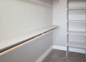 Thumbnail 17 of 17 - a room with a shelf and a closet