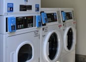 Thumbnail 5 of 25 - View of laundry facility with multiple washers and dryers