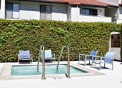 Thumbnail 4 of 25 - View of spa, lounge chairs, and shrubbery