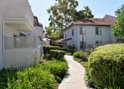 Thumbnail 8 of 25 - View of exterior building with sidewalk and green shrubbery