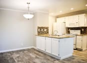 Thumbnail 23 of 25 - Large dining area with hardwood floors and modern lighting fixtures