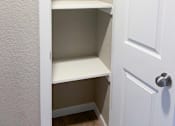 Thumbnail 4 of 12 - hallway closet  with built in shelving