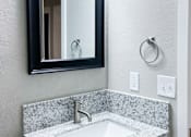 Thumbnail 8 of 12 - bathroom vanity with in laid sink, mirror, and lighting