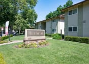 Thumbnail 16 of 34 - View of exterior of buildings with monument of Villas at Fair Oaks Logo