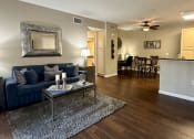 Thumbnail 2 of 19 - a living room with a couch and a coffee table