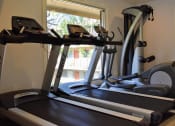 Thumbnail 23 of 23 - a treadmill in a gym with a window