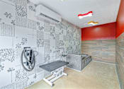 Thumbnail 47 of 76 - A bathroom with a shower and a bench.