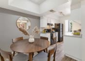 Thumbnail 23 of 36 - a dining room and kitchen with a table and chairs  at Glen Brae, Glendale, AZ, 85301