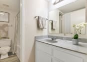 Thumbnail 30 of 36 - a white bathroom with a sink and a toilet  at Glen Brae, Glendale