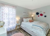 Thumbnail 27 of 36 - a bedroom with a bed and a window  at Glen Brae, Glendale