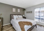 Thumbnail 25 of 36 - a bedroom with a large bed and a window  at Glen Brae, Glendale, AZ