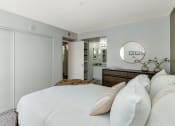 Thumbnail 26 of 36 - a bedroom with a large white bed and a bathroom  at Glen Brae, Arizona, 85301