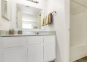 Thumbnail 29 of 36 - a bathroom with a sink and a mirror  at Glen Brae, Glendale, 85301