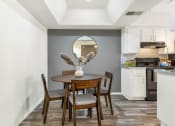 Thumbnail 24 of 36 - a kitchen and dining room with a table and chairs  at Glen Brae, Glendale, Arizona