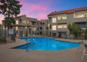 Thumbnail 1 of 36 - a swimming pool at night in front of an apartment buildingat Glen Brae, Glendale, 85301