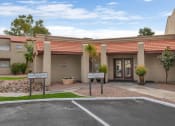 Thumbnail 36 of 36 - the front of a building with a driveway and a parking lot at Glen Brae, Glendale, Arizona