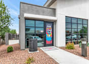 Thumbnail 68 of 81 - A building with a large window and a sign that says at Marketside Villas at Verrado, Buckeye, AZ