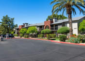 Thumbnail 13 of 34 - A street view of a residential area with houses and parked cars at Reflections at Red Mountain Apartments, Mesa 85213
