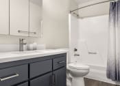Thumbnail 20 of 48 - a bathroom with a toilet sink and bathtub at Denim Scottsdale, Scottsdale, AZ