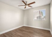 Thumbnail 14 of 48 - an empty room with a ceiling fan and a window at Denim Scottsdale, Scottsdale