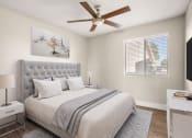 Thumbnail 11 of 48 - a bedroom with a large bed and a ceiling fan at Denim Scottsdale, Scottsdale, AZ